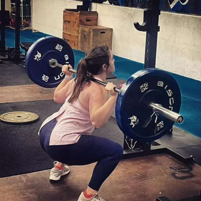 A member at the bottom of a heavy back squat